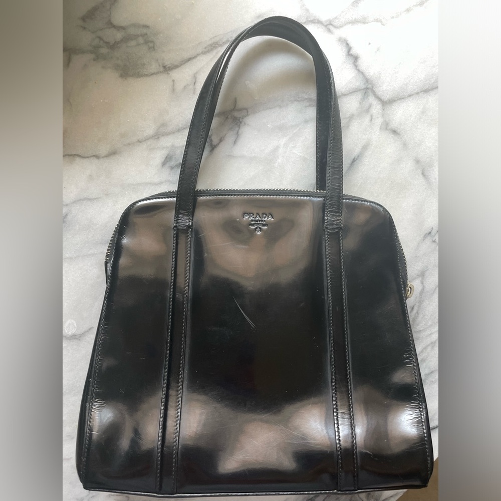 Prada Spazzolato patent leather purse.